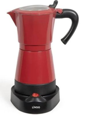 la cafetière rouge est posée sur un socle noir