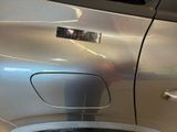 a close up of a car door with a sticker on it