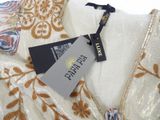 an image of a dress with a tag on the back of it