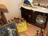 a picture of a cluttered room with a lot of stuff on the floor