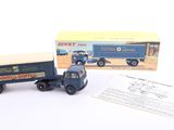 a blue toy truck with a box on the back
