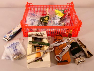 a red basket filled with assorted items on a table