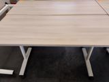 a close up of a table with two chairs and a laptop on it