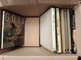 a box full of books sitting on top of a table