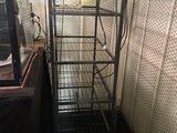 a metal ladder that is in the corner of a room