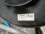 a sticker on the side of a table that has a pair of scissors on it
