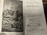 an open book with a picture of a boat in the water