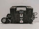 a black toolbox with a power cord attached to it
