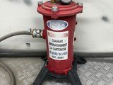 a red fire hydrant with a hose attached to it