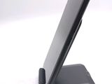 a cell phone that is sitting on top of a stand