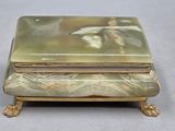 a box with a painting on it sitting on a table