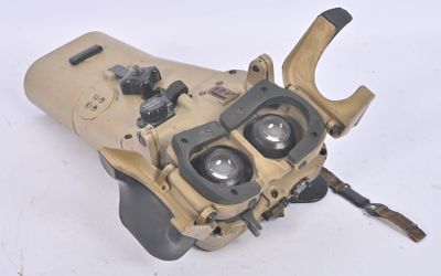 an image of a pair of binoculars sitting on top of a white surface