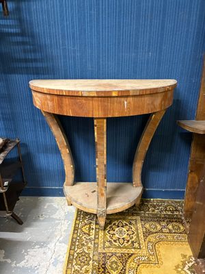 a small table with a wooden top in a room