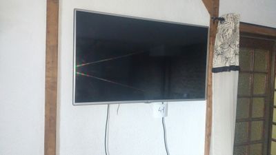 a flat screen tv mounted on the wall in the living room