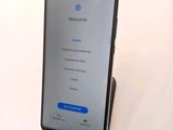 the back of a phone with a welcome screen displayed on it