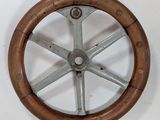 an image of a close up of a steering wheel on a wall