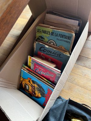 a box full of books sitting on the floor