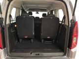 two seats in the back of a van with the doors open