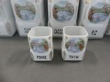 four mugs that are sitting on a table