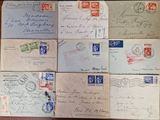 several old envelopes are sitting on top of a wooden table