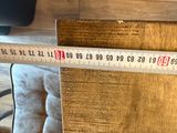 a measuring tape that is on top of a wooden table
