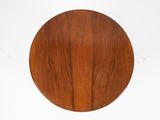an image of a round table with a wooden top on a white background