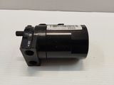 a close up of a black motor on a white surface