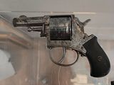 a gun that is on display in a glass case