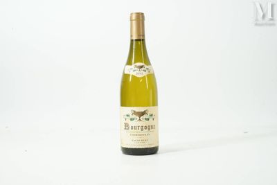 a bottle of wine that is sitting on a table