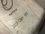 a close up of a wooden barrel with a logo on it