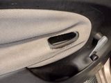 a close up of the inside of a car door handle