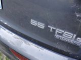 a close up of a car ' s emblem on the back of it