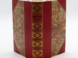 a red book with gold trim on it