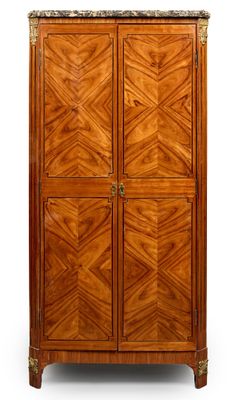 a tall wooden cabinet with two doors and a marble top