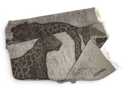 a scarf with a giraffe on it on a white background
