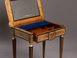 an antique writing desk with a mirror on top of it
