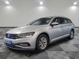 the volkswagen passat is parked in a large room with a checkered floor
