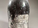 a bottle of wine that is sitting on a table