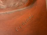 a close up of a bronze sculpture of a man ' s head