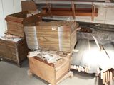 a lot of wood in a room with a lot of boxes on the floor