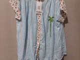 a blue and white striped shirt hanging on a hanger