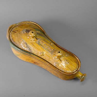 an image of a wooden box with a lid on a gray surface