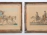 two framed pictures of a couple of people riding on a horse drawn carriage