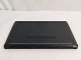 a black laptop sitting on a white surface