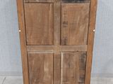an image of a wooden cabinet with a door on top of it