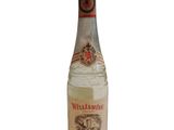 an image of a bottle of white wine sitting on top of a table
