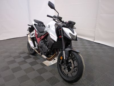 a motorcycle that is parked in a room with a checkered floor