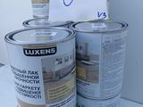 several cans of paint are stacked on top of each other