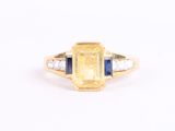 a yellow sapphire and diamond ring