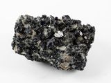 a close up of a rock with a lot of black crystals on it
